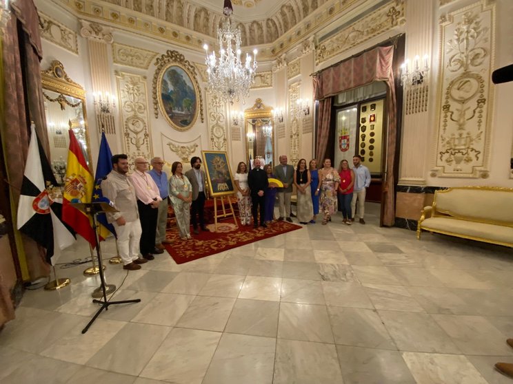 Foto de familia con el cartel